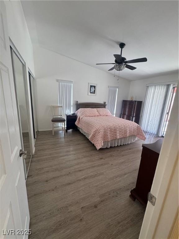 bedroom featuring wood finished floors, a ceiling fan, and baseboards