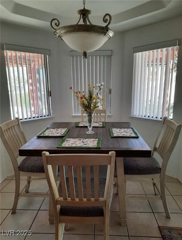 dining space with tile patterned flooring