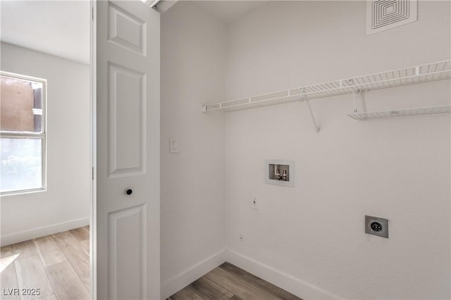 laundry area with visible vents, washer hookup, wood finished floors, laundry area, and electric dryer hookup