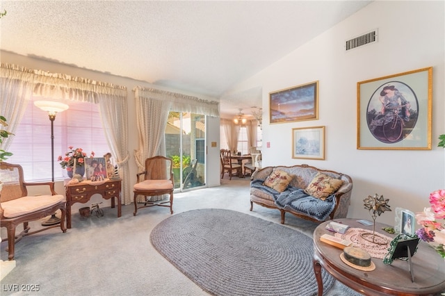 7617 Sea Cliff Way, Las Vegas, NV 89128 - living area featuring carpet flooring and vaulted ceiling