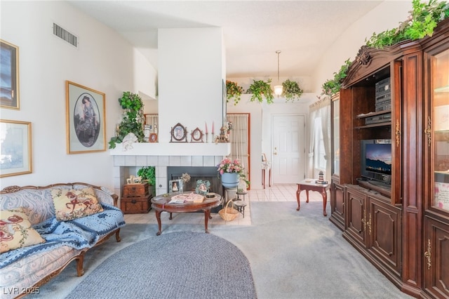 7617 Sea Cliff Way, Las Vegas, NV 89128 - living room with carpet floors and a tile fireplace