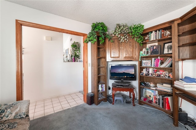7617 Sea Cliff Way, Las Vegas, NV 89128 - living area featuring tile patterned floors, a textured ceiling, and carpet