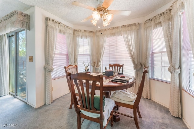 7617 Sea Cliff Way, Las Vegas, NV 89128 - dining area with light carpet, healthy amount of natural light, baseboards, and a textured ceiling