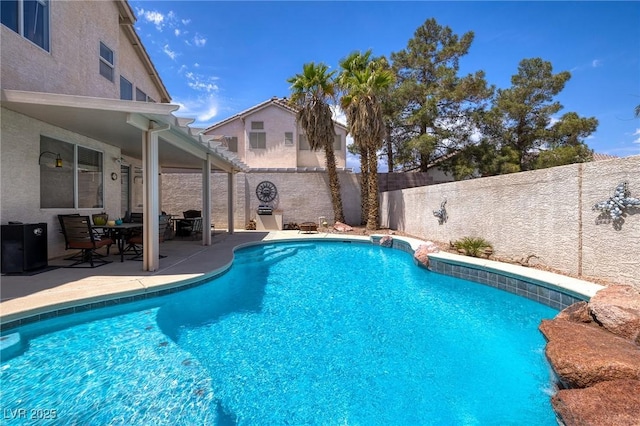 view of pool with a patio, a fenced in pool, and a fenced backyard