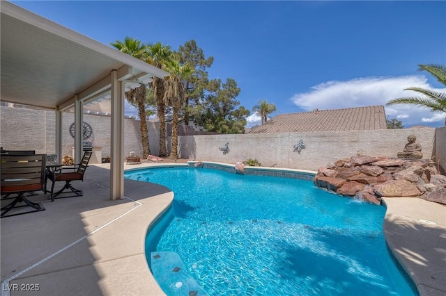 view of pool with a fenced backyard, a patio area, and a fenced in pool