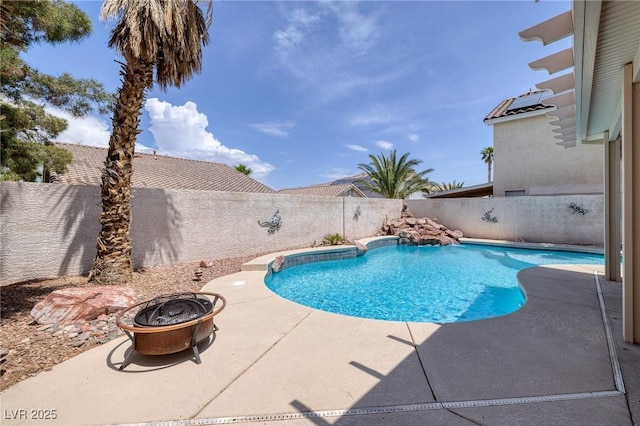 view of pool with an outdoor fire pit, a patio, a fenced in pool, and a fenced backyard