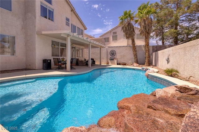 view of pool with a patio area, a fenced in pool, and a fenced backyard