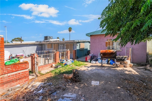 1708 Weeping Willow Ln, Las Vegas, NV 89104 - rear view of house featuring stucco siding
