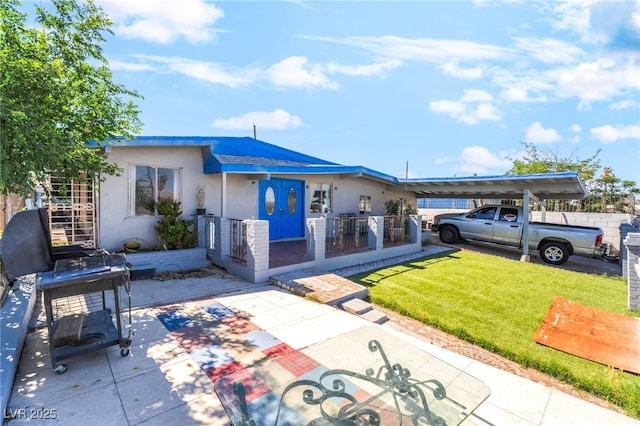 1708 Weeping Willow Ln, Las Vegas, NV 89104 - view of front of home with stucco siding and a carport