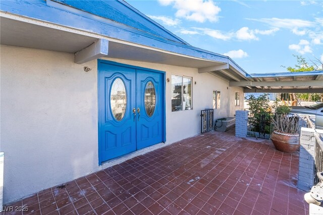 1708 Weeping Willow Ln, Las Vegas, NV 89104 - doorway to property featuring stucco siding