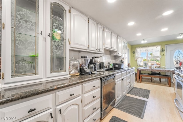 1708 Weeping Willow Ln, Las Vegas, NV 89104 - kitchen featuring dishwasher, white cabinetry, recessed lighting, light wood-style floors, and a sink