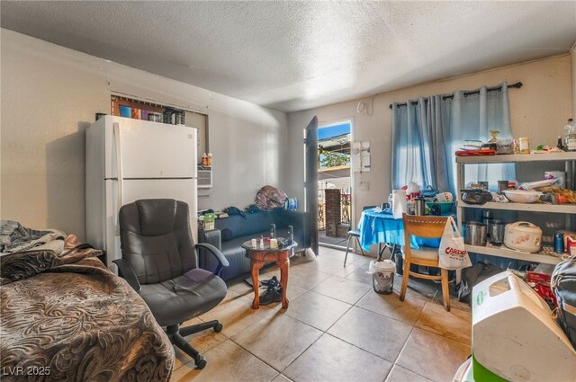 1708 Weeping Willow Ln, Las Vegas, NV 89104 - living area featuring a textured ceiling and light tile patterned flooring