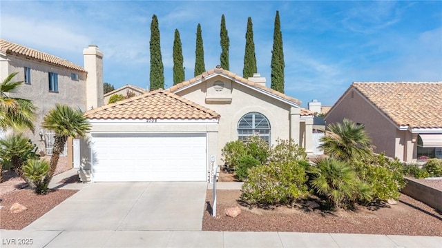 2708 Norbeck St, Las Vegas, NV 89117 - mediterranean / spanish-style house with a garage, concrete driveway, stucco siding, and a tiled roof