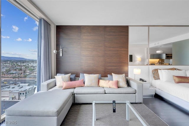 living area featuring a mountain view and wood finished floors