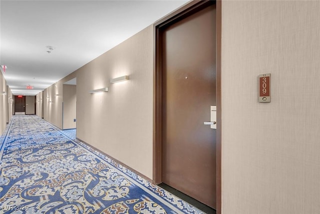 hall featuring light colored carpet