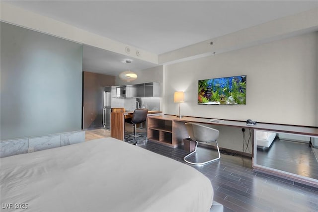 bedroom with wood finished floors