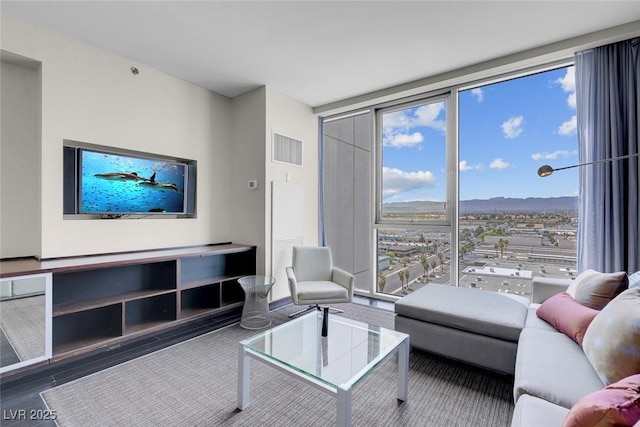 living area featuring floor to ceiling windows