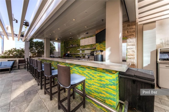 view of patio featuring an outdoor living space and outdoor dry bar