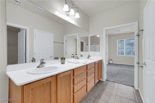 full bath featuring tile patterned floors, visible vents, and a sink