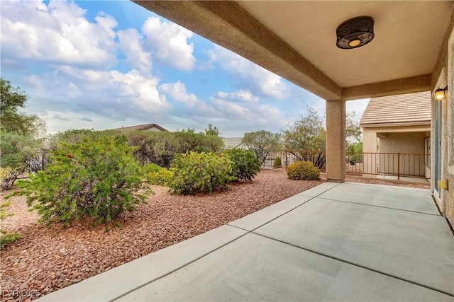 view of patio / terrace featuring fence
