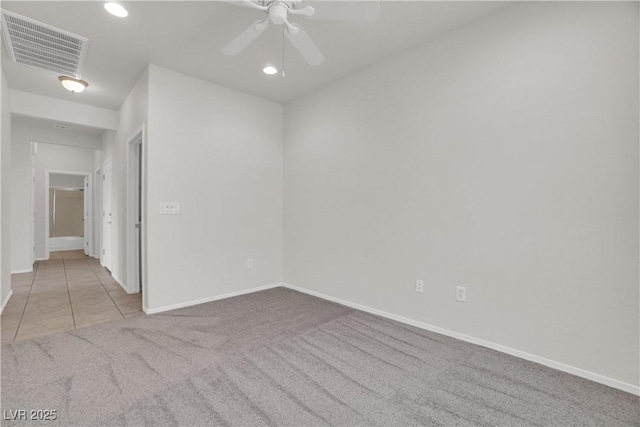 empty room featuring carpet, visible vents, recessed lighting, a ceiling fan, and baseboards