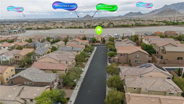 bird's eye view featuring a mountain view and a residential view