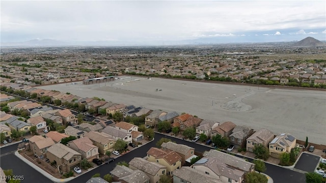aerial perspective of suburban area featuring a mountain backdrop