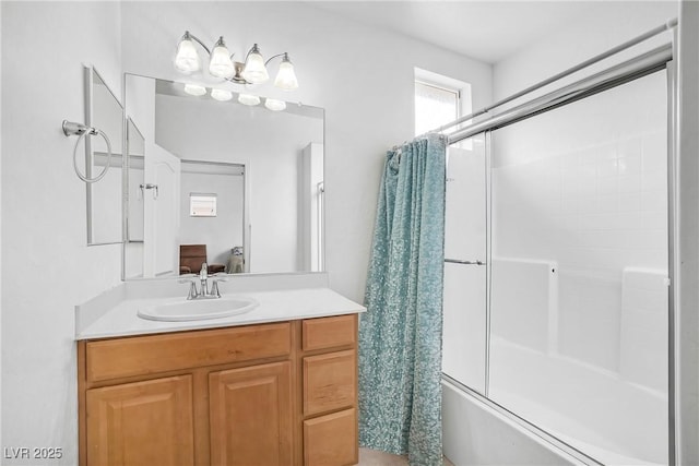ensuite bathroom with bath / shower combo with glass door and vanity