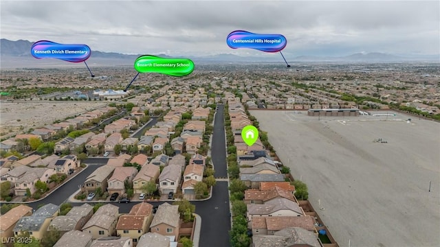 aerial view of residential area with a mountainous background