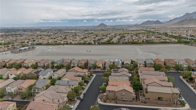 view of property location with nearby suburban area and mountains