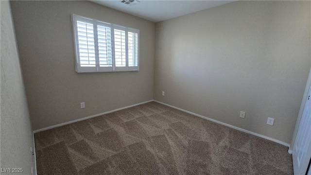 carpeted empty room with baseboards and visible vents