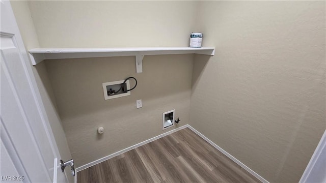 clothes washing area featuring laundry area, gas dryer hookup, dark wood-style floors, baseboards, and hookup for a washing machine