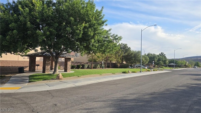 view of road with street lighting and sidewalks