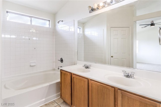full bath featuring tile patterned floors, double vanity, tub / shower combination, and a sink
