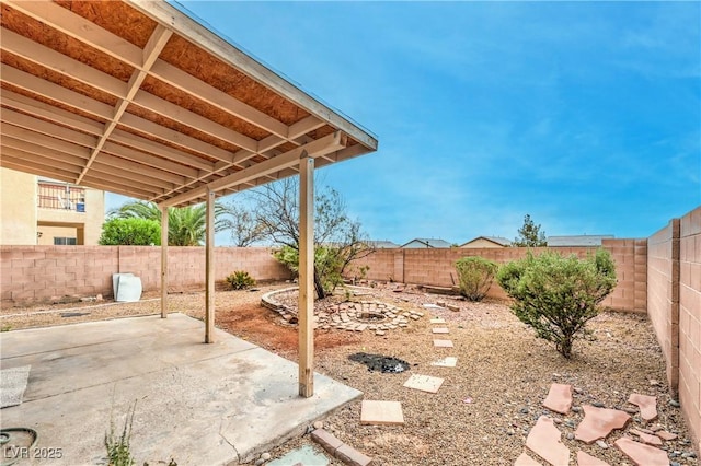 view of yard with a patio and a fenced backyard