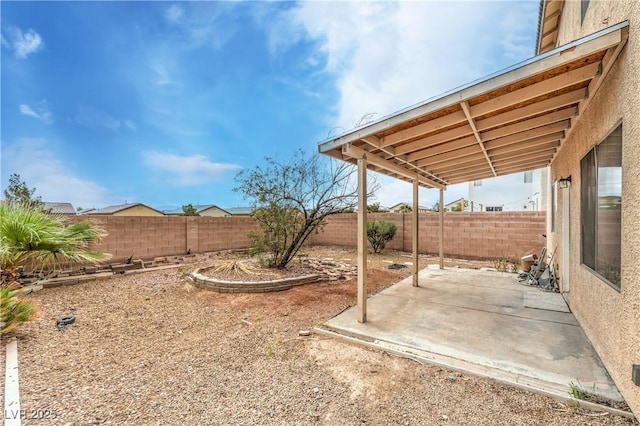 view of yard with a patio area and a fenced backyard