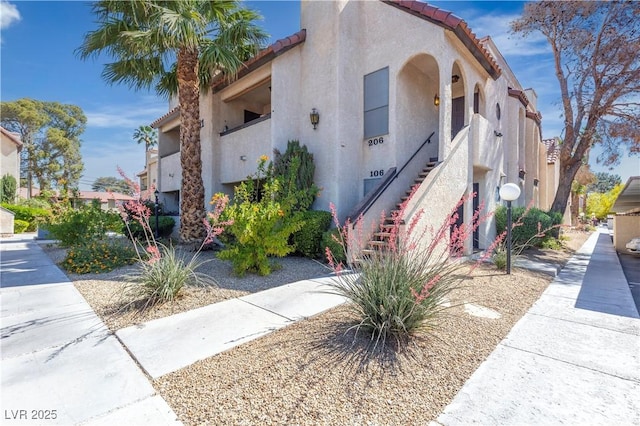 view of property featuring stairway