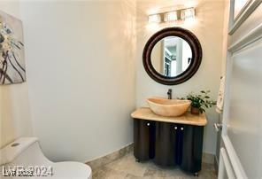 9101 Alta Dr Unit 507, Las Vegas, NV 89145 - half bathroom with toilet and vanity