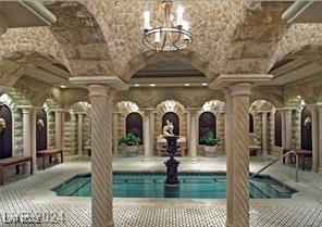 9101 Alta Dr Unit 507, Las Vegas, NV 89145 - swimming pool with ornate columns and a chandelier
