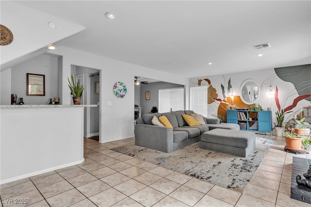 living room with light tile patterned floors, recessed lighting, and a ceiling fan