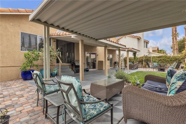 view of patio with a fire pit