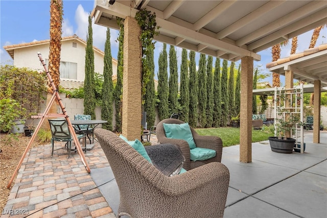view of patio featuring outdoor dining area and a fenced backyard