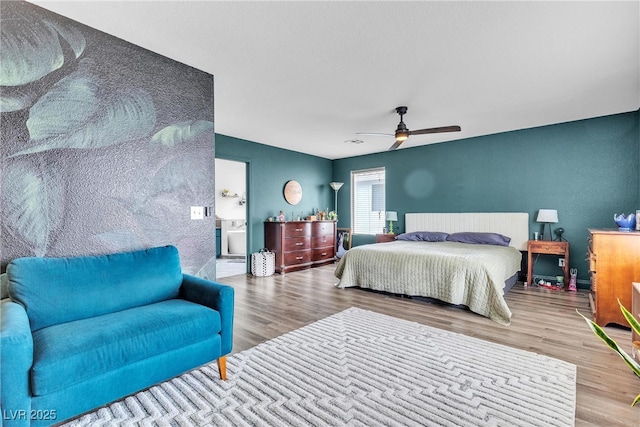 bedroom featuring wood finished floors and a ceiling fan