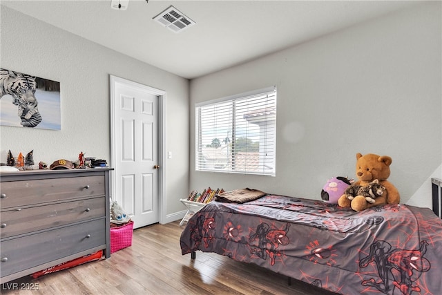 bedroom with light wood-style floors