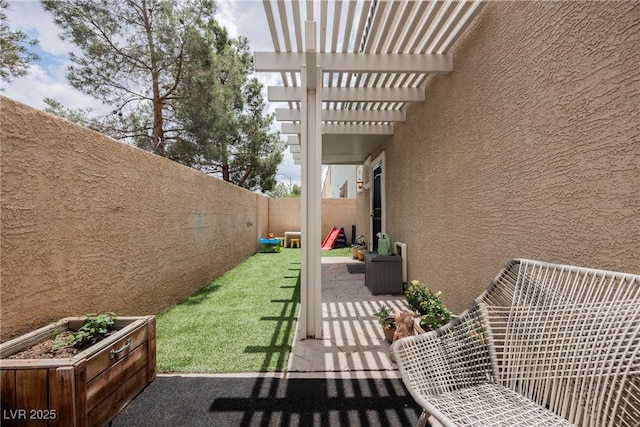 fenced backyard featuring a patio and a pergola
