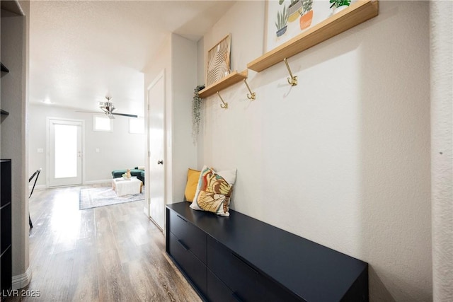 mudroom with wood finished floors and ceiling fan