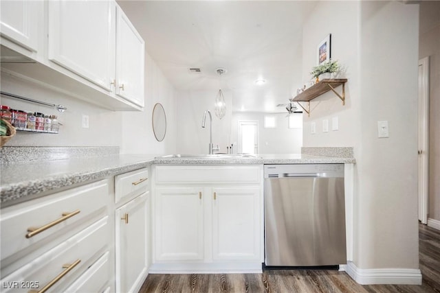kitchen featuring dishwasher, a sink, dark wood finished floors, and white cabinetry