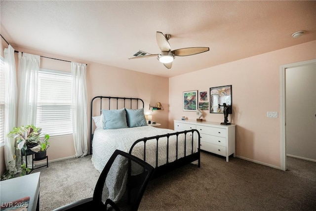 carpeted bedroom with baseboards and a ceiling fan