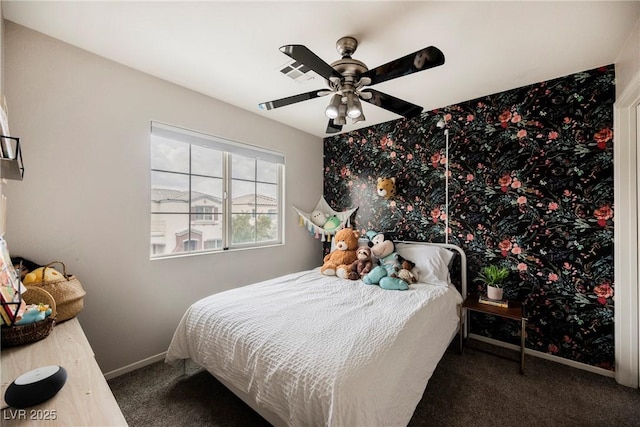 carpeted bedroom featuring baseboards and a ceiling fan