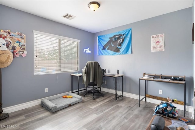 home office with wood finished floors and baseboards